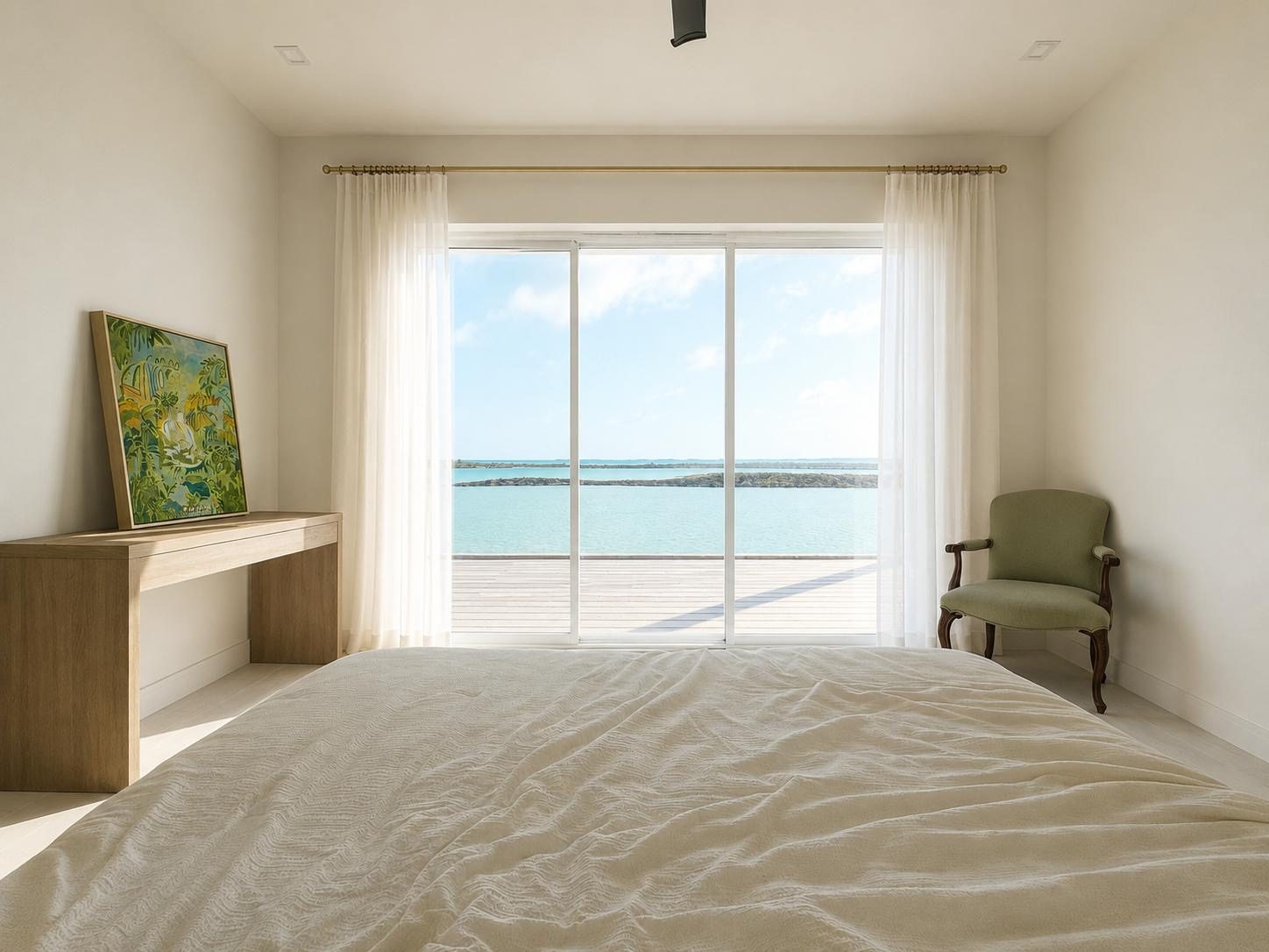 Bedroom with sliding doors onto the deck and ocean view